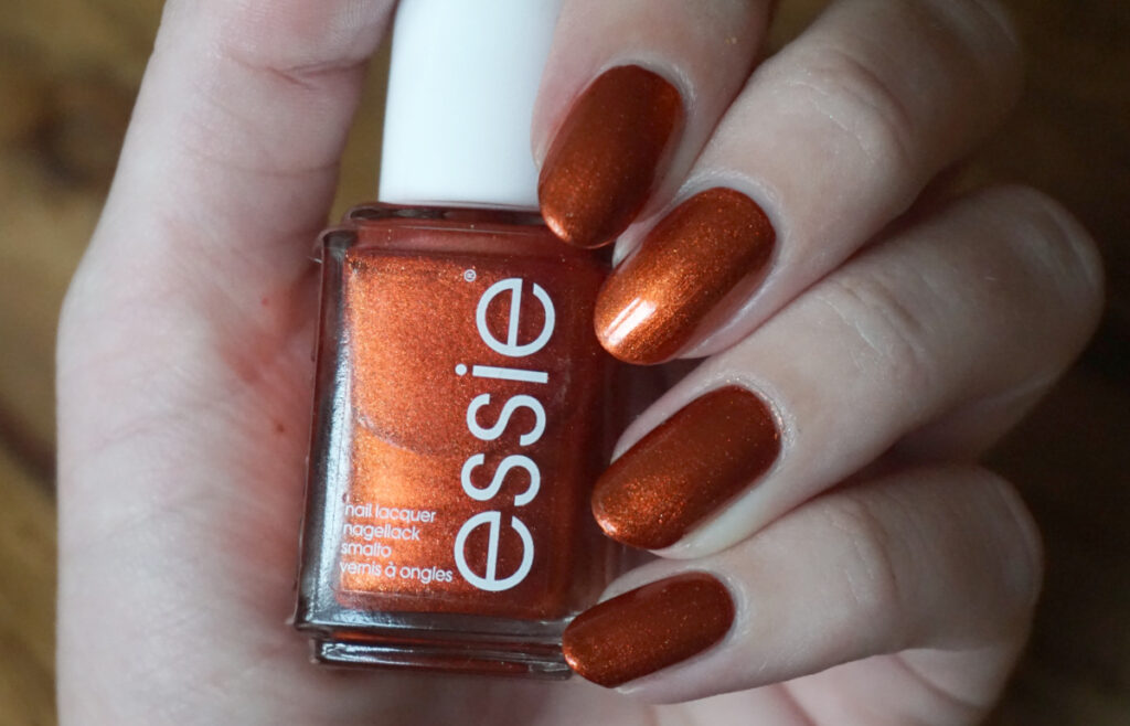 Swatch of Essie say it ain't soho an orange shimmer from Essie's fall 2018 collection